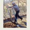 Gardener using the 7 Tine Unbreakable Broadfork to loosen compacted garden soil without tilling